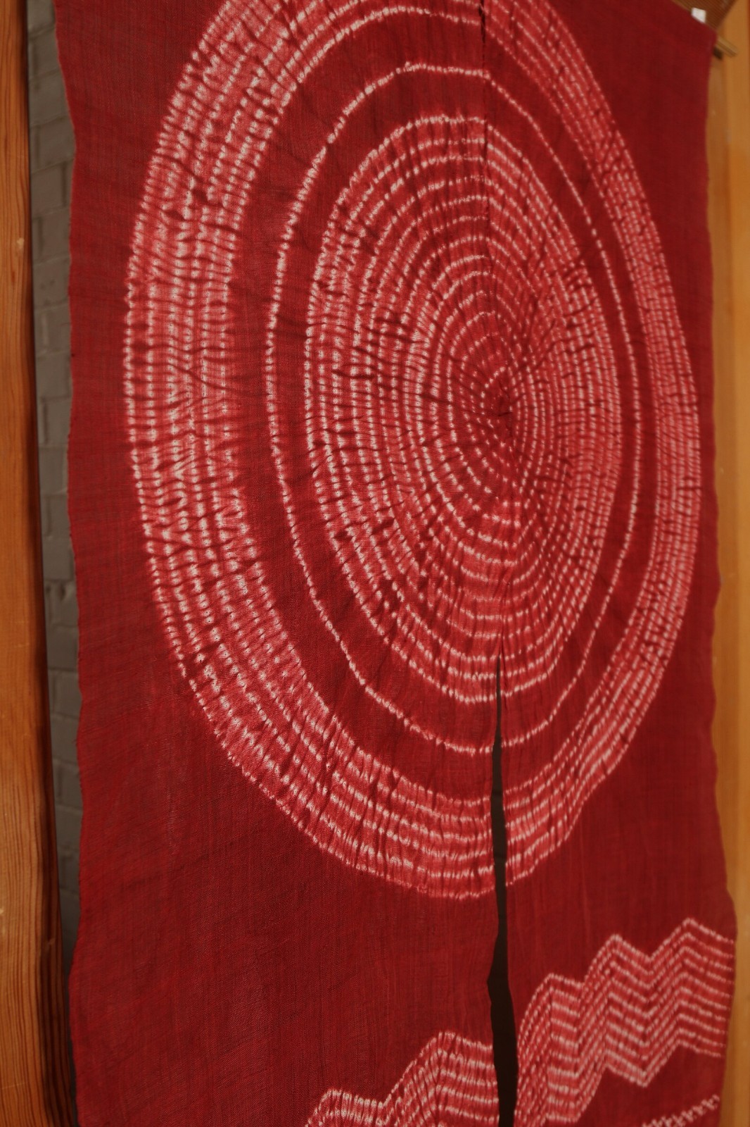 Traditional linen noren, door way curtain. sun and wave on red